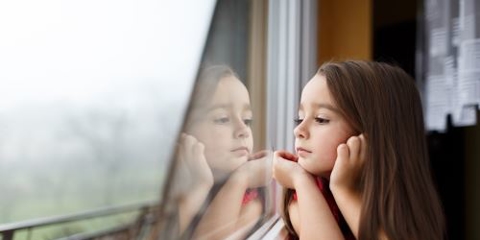 little girl looking out the window